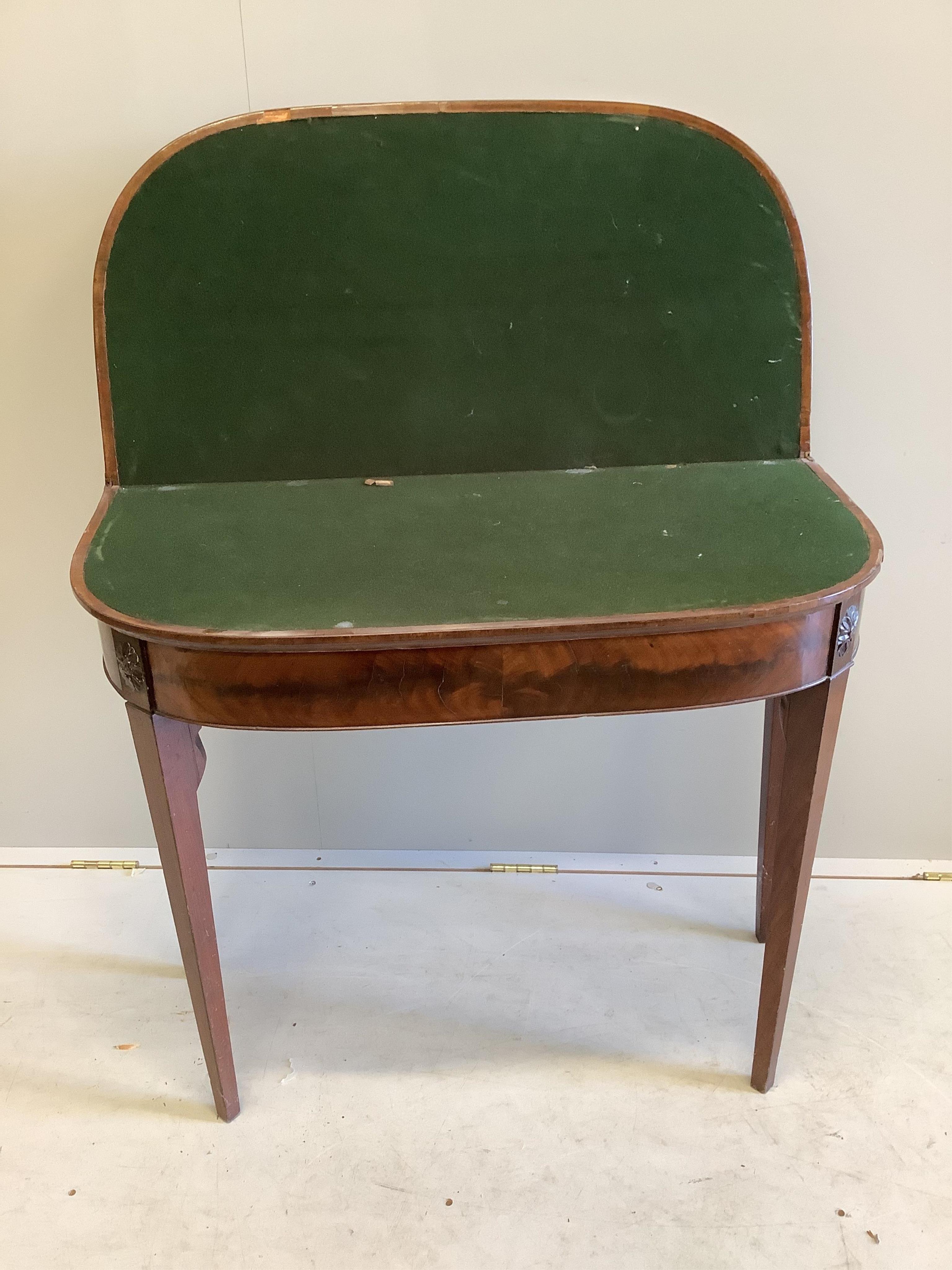 A George III mahogany D shaped folding card table, on square tapering legs, width 86cm, depth 42cm, height 73cm